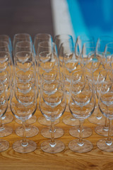 A lot of wine glasses in a table