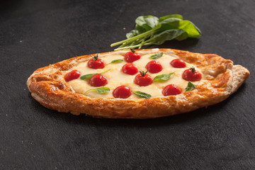 Traditional Turkish baked pide dish. Middle Eastern snacks. Turkish pizza. Pide with cheese. Open pie with cheese