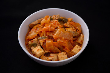 A Korean stew with fermented kimchi called Kimchi Jjigae
