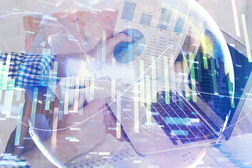 Fototapeta na wymiar Double exposure of businessman working on laptop on background. International business hologram in front. Concept of success.