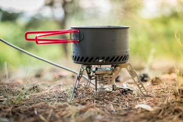 Foldable camping gas fire system  with a pot with radiator for fast heating
