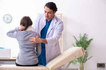 Young male doctor and female beautiful patient 