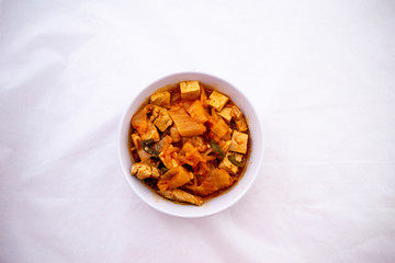 A Korean stew with fermented kimchi called Kimchi Jjigae