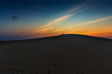 Naklejka na ściany i meble Adventure Photographer in Desert Dammam Saudi Arabia
