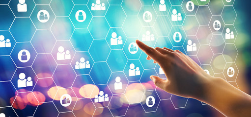 Human resources theme with hand pressing a button on a technology screen