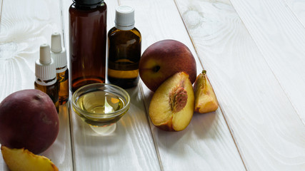 peach seed oil on a light wooden table