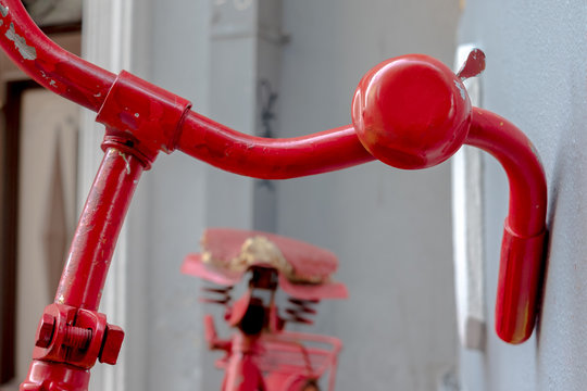Parked old red bicycle - Powered by Adobe