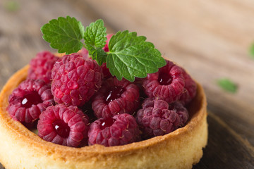 Cake with fresh raspberries and mint