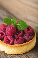 Cake with fresh raspberries and mint