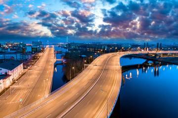 Obraz premium Saint Petersburg. Russia. Betancourt bridge. Petersburg expressway in the evening panorama. Illuminated speed highway. Petersburg transport interchanges. Neva River. Cities of Russia.