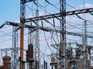 Transformer substation. High voltage wires. Ceramic insulators. Industrial landscape