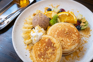 pancake with mix fruits (strawberry, blueberries, raspberries, mango, kiwi)