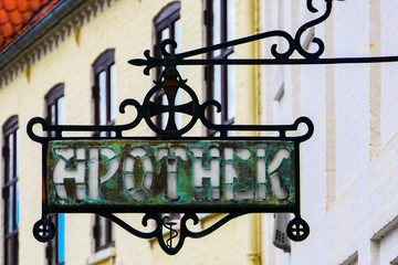 Sæby, Denmark An old and antique apothek sign for the pharmacy.