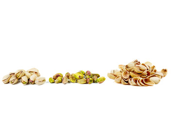 Roasted pistachios and shells isolated on white background