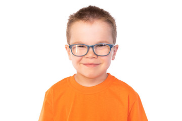 Fototapeta premium Little cute boy with glasses smiling isolated on white background
