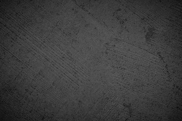 Art black concrete stone texture for background in black.