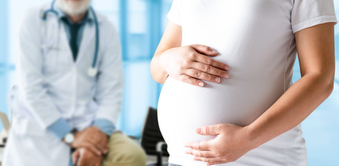 Happy pregnant woman visit gynecologist doctor at hospital or medical clinic for pregnancy...