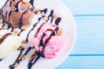 Ice cream with walnuts and chocolate topping