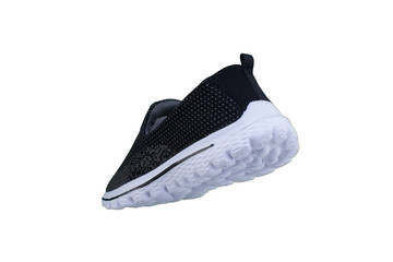 Black sneakers on white soles. Sport shoes on a white background.