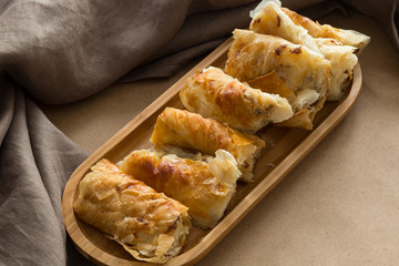 Comfort food homemade Borek  closeup. Sliced Phyllo pastry pie with cheese and mincemeat. 