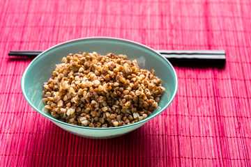bowl full of buckwheat and chopsticks