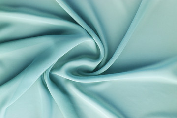 turquoise fabric with large folds