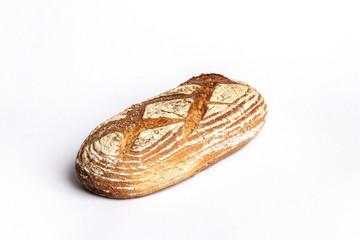 Fresh home-made bread with a crispy crust, on white background.