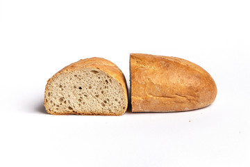 Fresh home-made bread with a crispy crust, on white background.