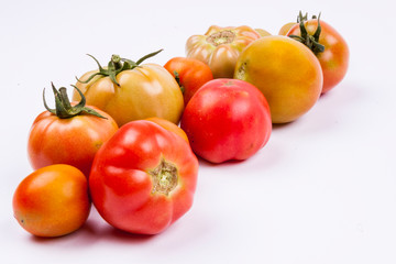 Red tomatoes - white background.