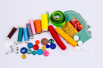 Sewing accessories on white background.