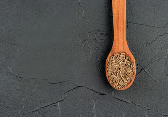 Dry cumin in spoon