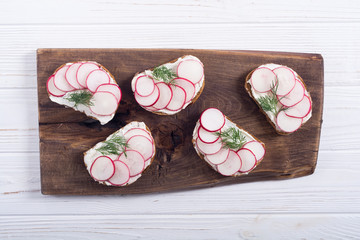 Healthy vegetable toasts sandwith with radish and dill