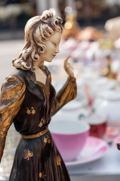 Statue of young fashion woman on flea market