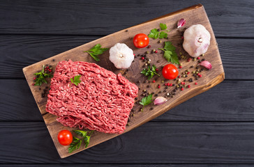Raw minced beef meat with spices and herbs
