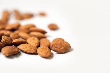 Almond nuts in wooden bowl. Food mix background, top view, copy space, banner. Assortment of nuts - cashew,  almonds, 