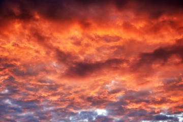 Fototapeta na wymiar Red clouds at sunset, fire on black background
