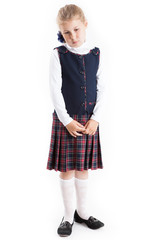 Unhappy and sad Caucasian schoolgirl standing dressed school uniform, isolated on a white background