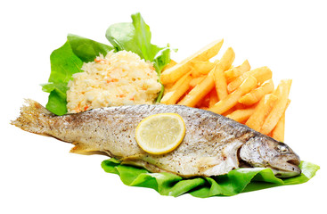 Dinner meal with trout fish, chips and vegetable salad