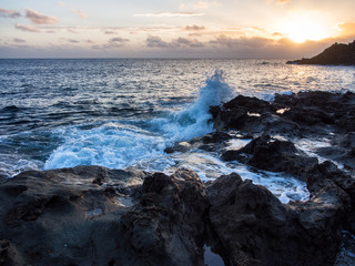 sunrise wave breaks on the rock, Pantelleria, Italy