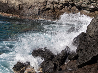 wave breaks on the rock, Pantelleria, Italy