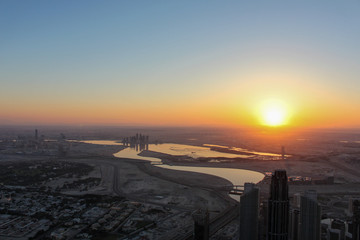 sunrise and aerial view of dubai city