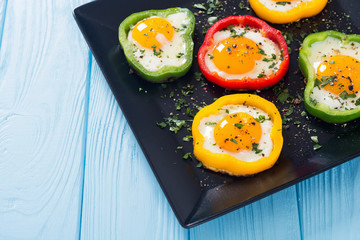 Yellow , red and green pepper with fried eggs