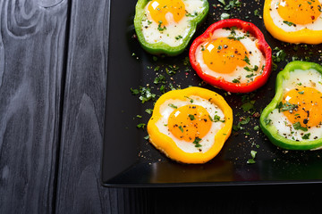 Yellow , red and green pepper with fried eggs
