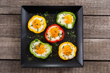 Yellow , red and green pepper with fried eggs