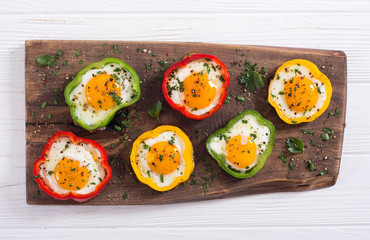 Yellow , red and green pepper with fried eggs