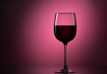 Red A Berry Drink Or Red Wine Into A Glass Goblet On A Background.