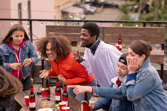 Young Multicultural Friends With Beer While Cheering For Their Hockey Team