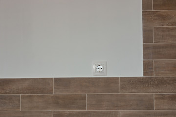 white sockets and switches on the wall being repaired
