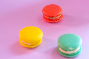 Close-up shot of colored macaroons in different position