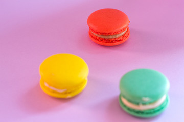 Close-up shot of colored macaroons in different position